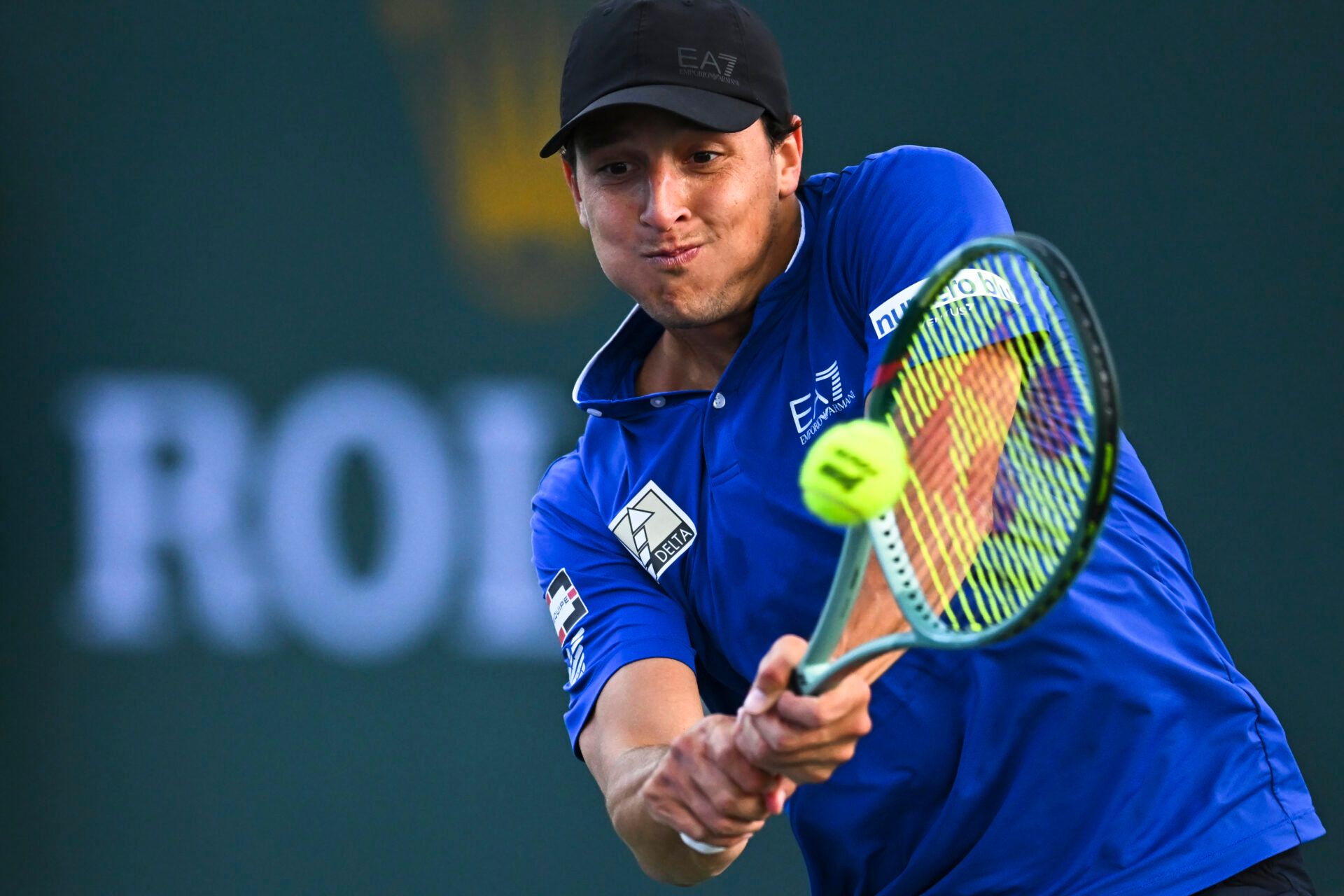 Luciano Darderi (ITA) hits a ball against Hugo Gaston (FRA) in the BNP Paribas Open at the Indian Well Tennis Garden.