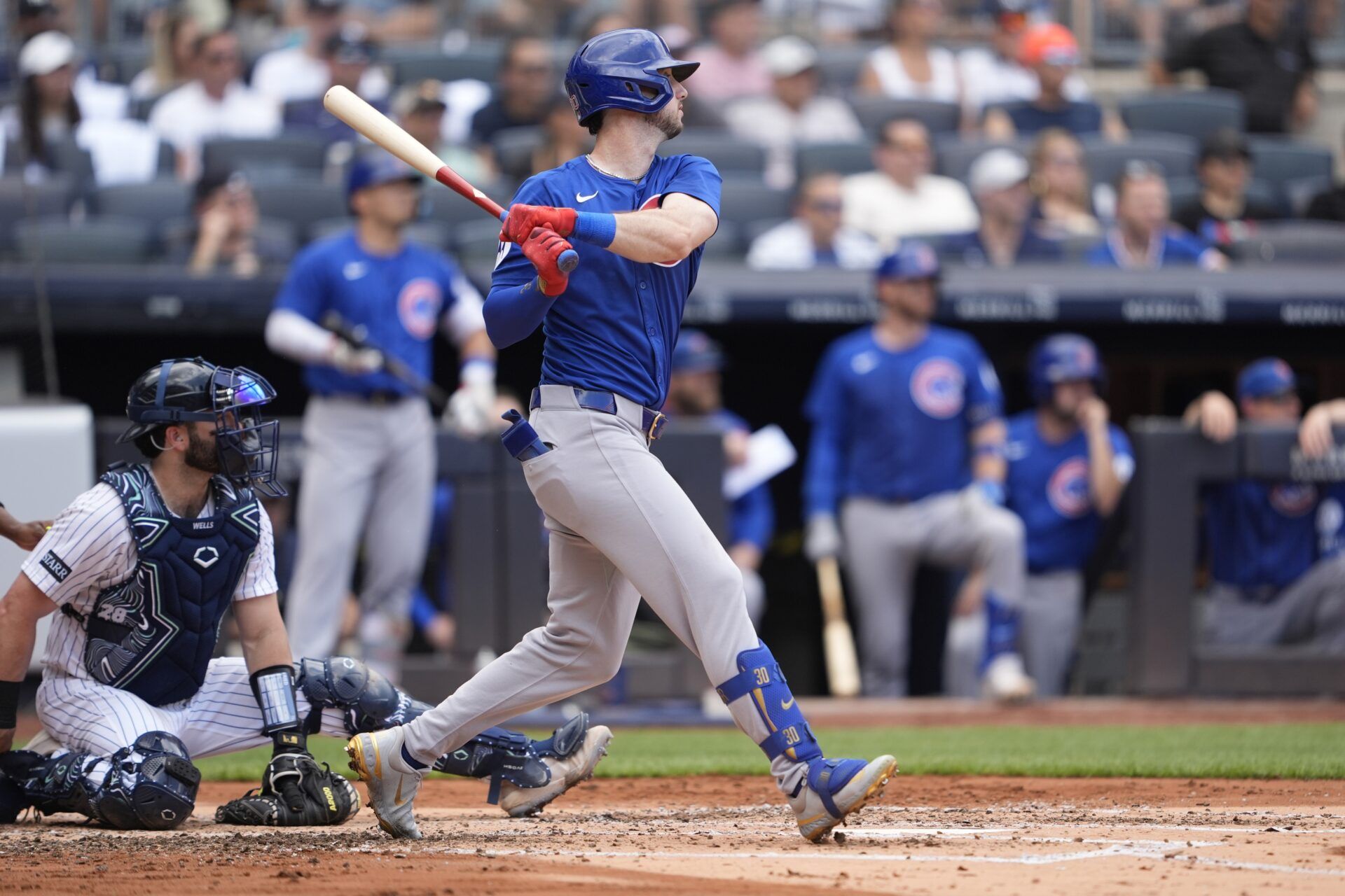 Chicago Cubs right fielder Kyle Tucker (30) hits a single against the New York Yankees during the third inning at Yankee Stadium.