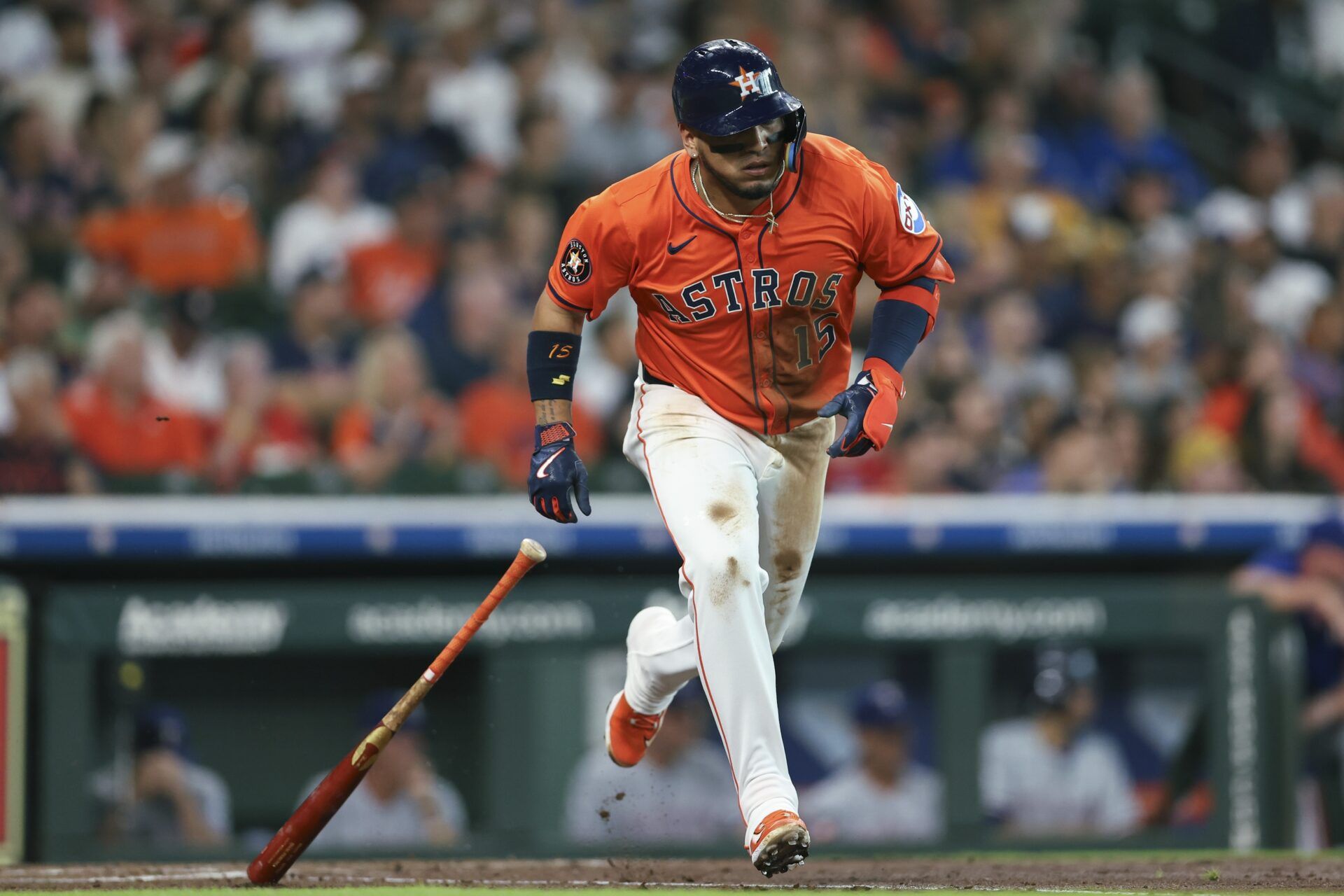 Houston Astros third baseman Isaac Paredes (15) hits a single during the first inning against the Texas Rangers at Daikin Park.