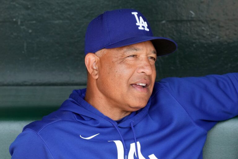 Los Angeles Dodgers manager Dave Roberts (30) sits in the dugout before the game against the San Francisco Giants at Oracle Park.
