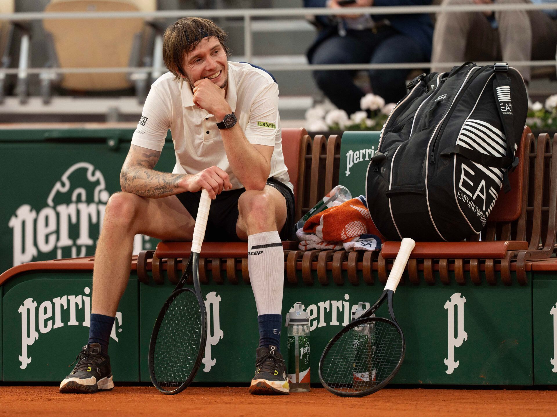 Alexander Bublik of Kazakhstan at a change of ends during his match against Jannik Sinner of Italy on day 11 at Roland Garros Stadium.
