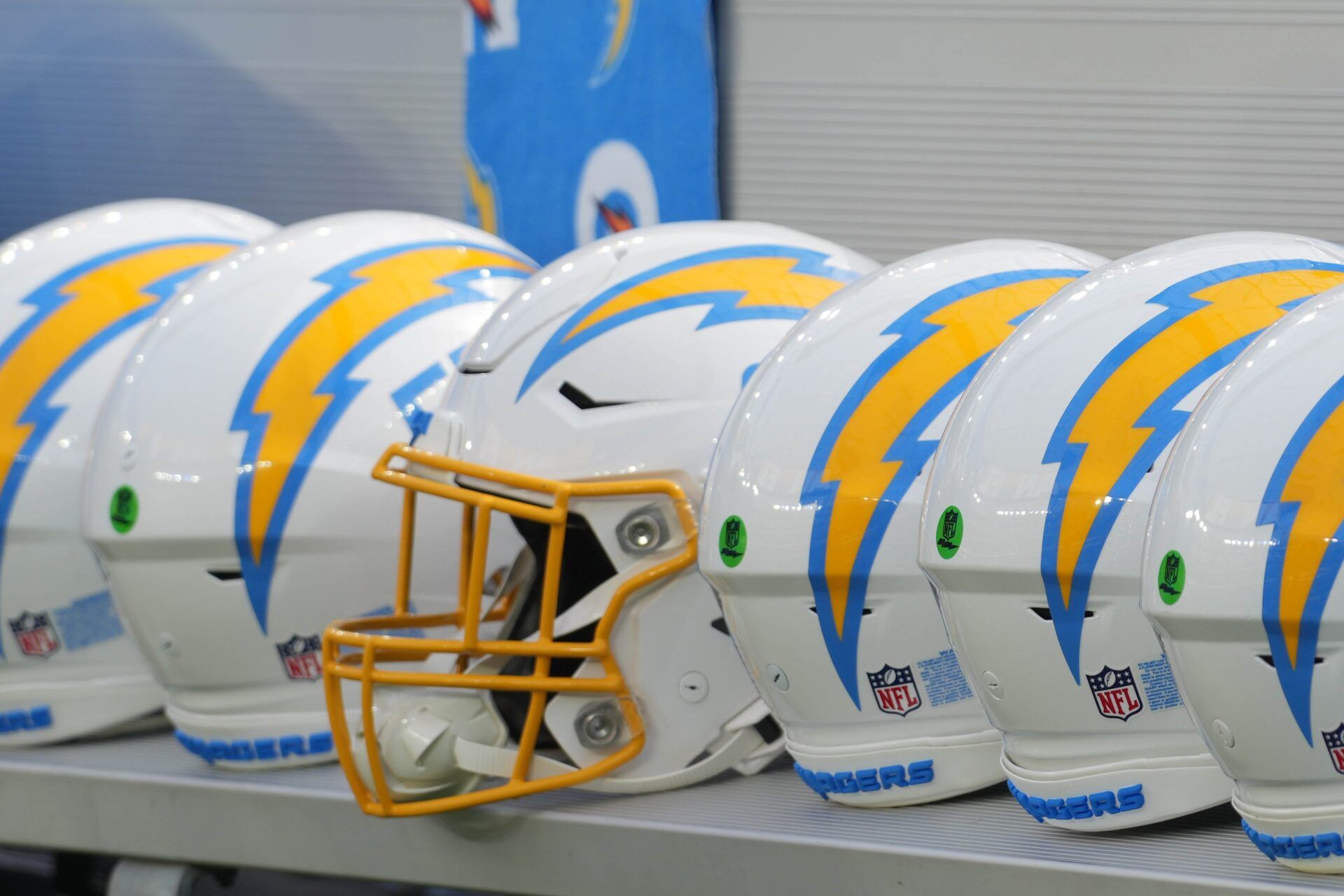 Los Angeles Chargers helmets on the bench at SoFi Stadium.