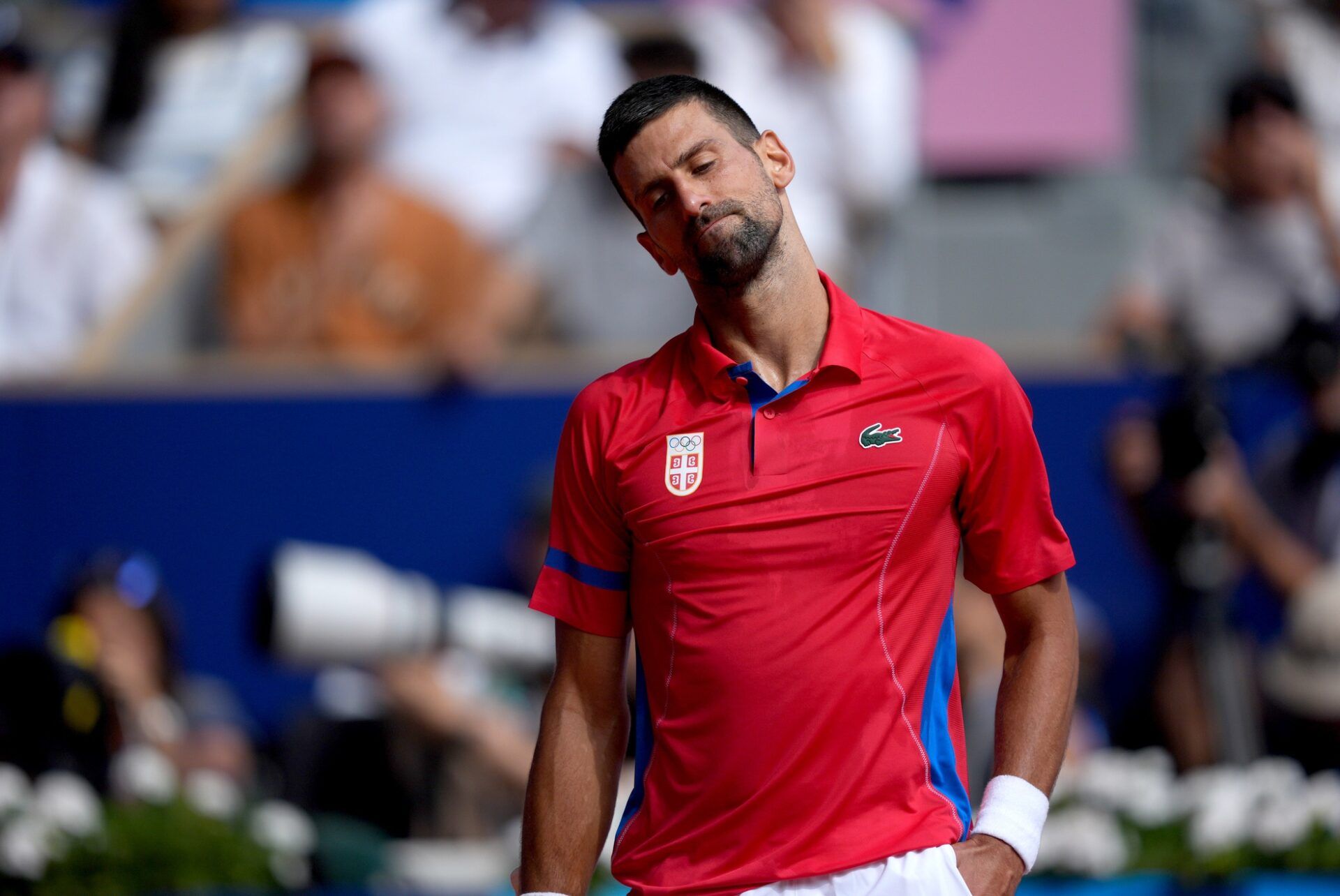 Novak Djokovic (SRB) reacts after a point in the men’s singles gold medal match against Carlos Alcaraz (not pictured) during the Paris 2024 Olympic Summer Games at Stade Roland Garros.