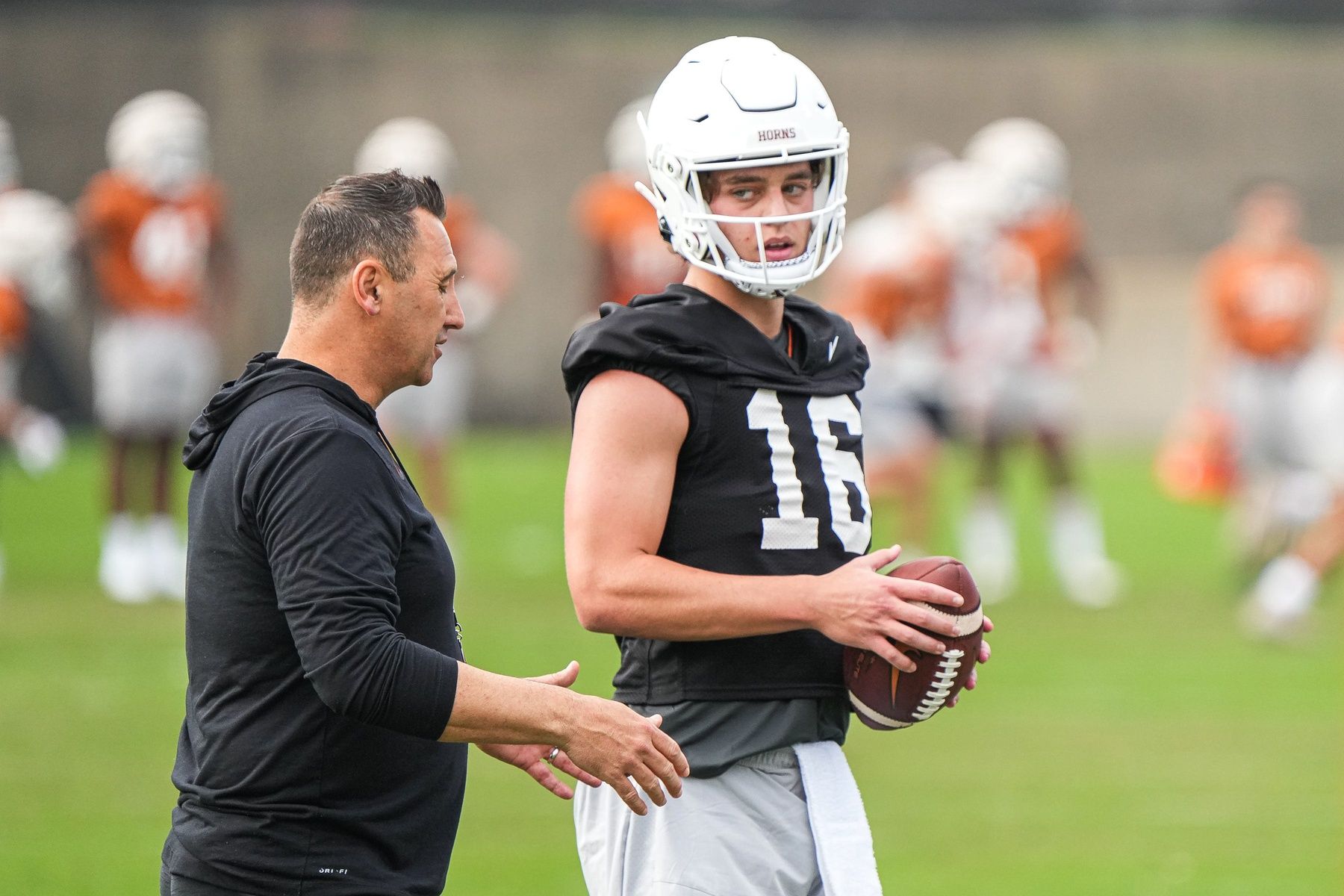 Texas head coach Steve Sarkisian talks to quarterback Arch Manning (16) during the first Texas Longhorns football practice of 2023 at the Frank Denius Fields on the University of Texas at Austin campus on Monday, March 6, 2023.

Aem Texfoot First 2023 Practice 7