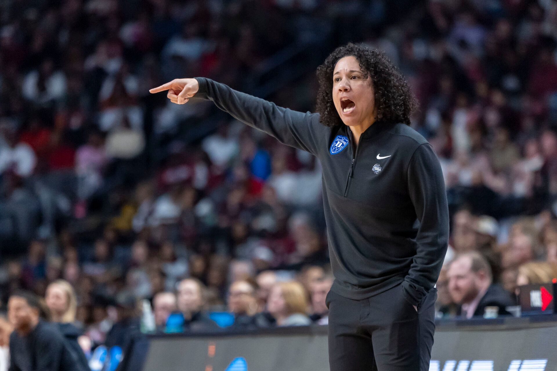 Duke Blue Devils head coach Kara Lawson coaches her team during the second half of an Elite 8 NCAA Tournament basketball game against the South Carolina Gamecocks at Legacy Arena.