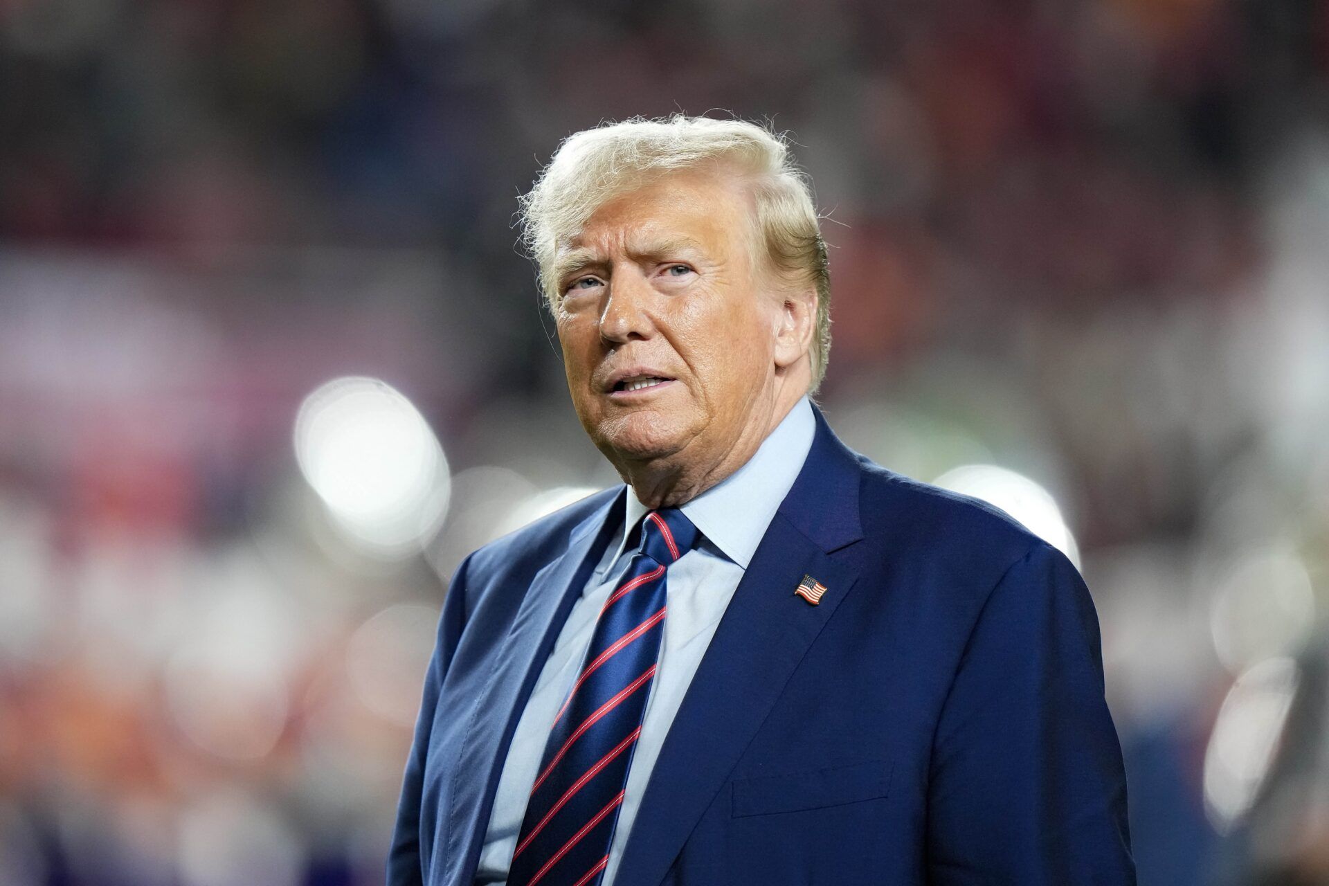 Former President Donald Trump looks on at half time of a game between the South Carolina Gamecocks and the Clemson Tigers at Williams-Brice Stadium.