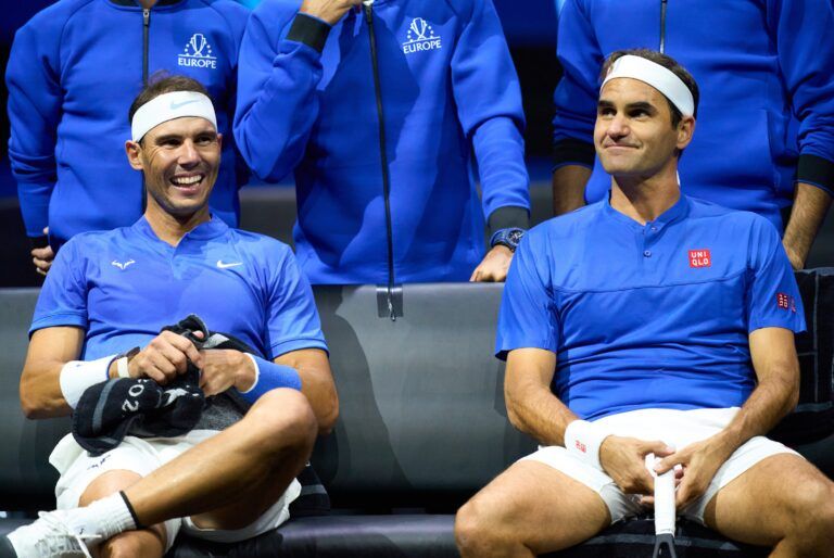Roger Federer (SUI) and Rafael Nadal (ESP) change ends while playing against Jack Sock (USA) and Frances Tiafoe in a Laver Cup tennis match.