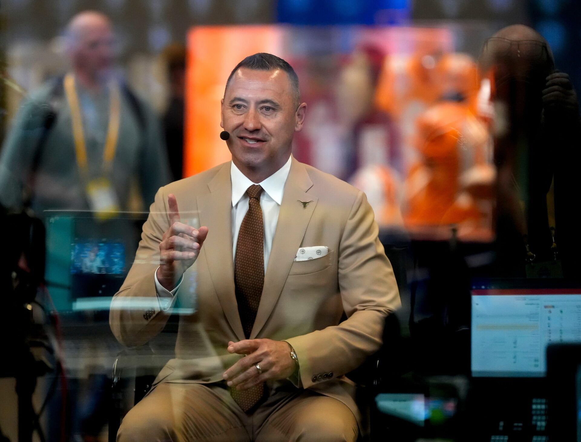 Texas head coach Steve Sarkisian is interviewed by one of the TV media teams during SEC Media Days at the College Football Hall of Fame in Atlanta.