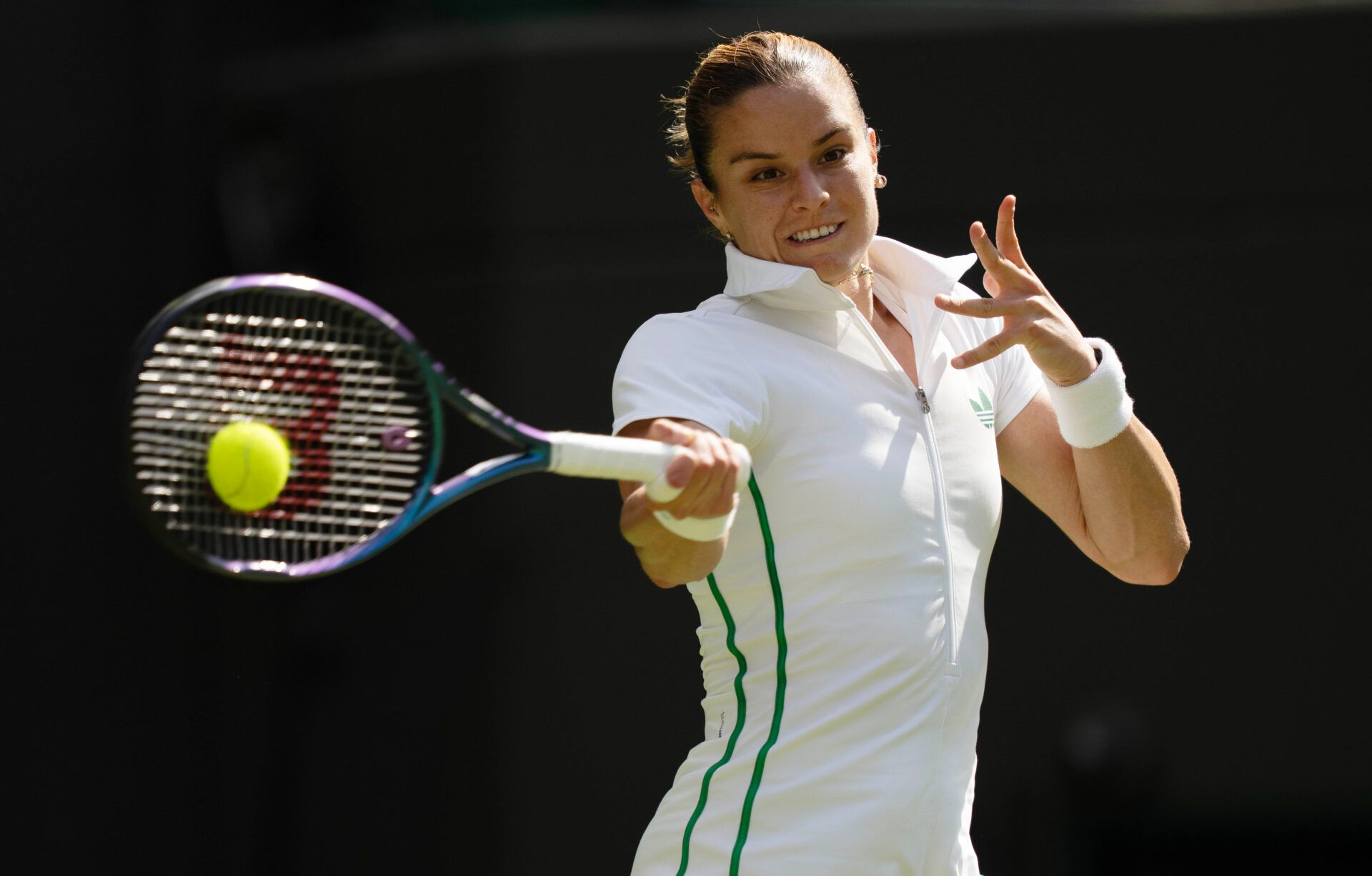 Maria Sakkari of Greece returns a shot during her match against Elena Rybakina of Kazakhstan on day four at the All England Lawn Tennis and Croquet Club.
