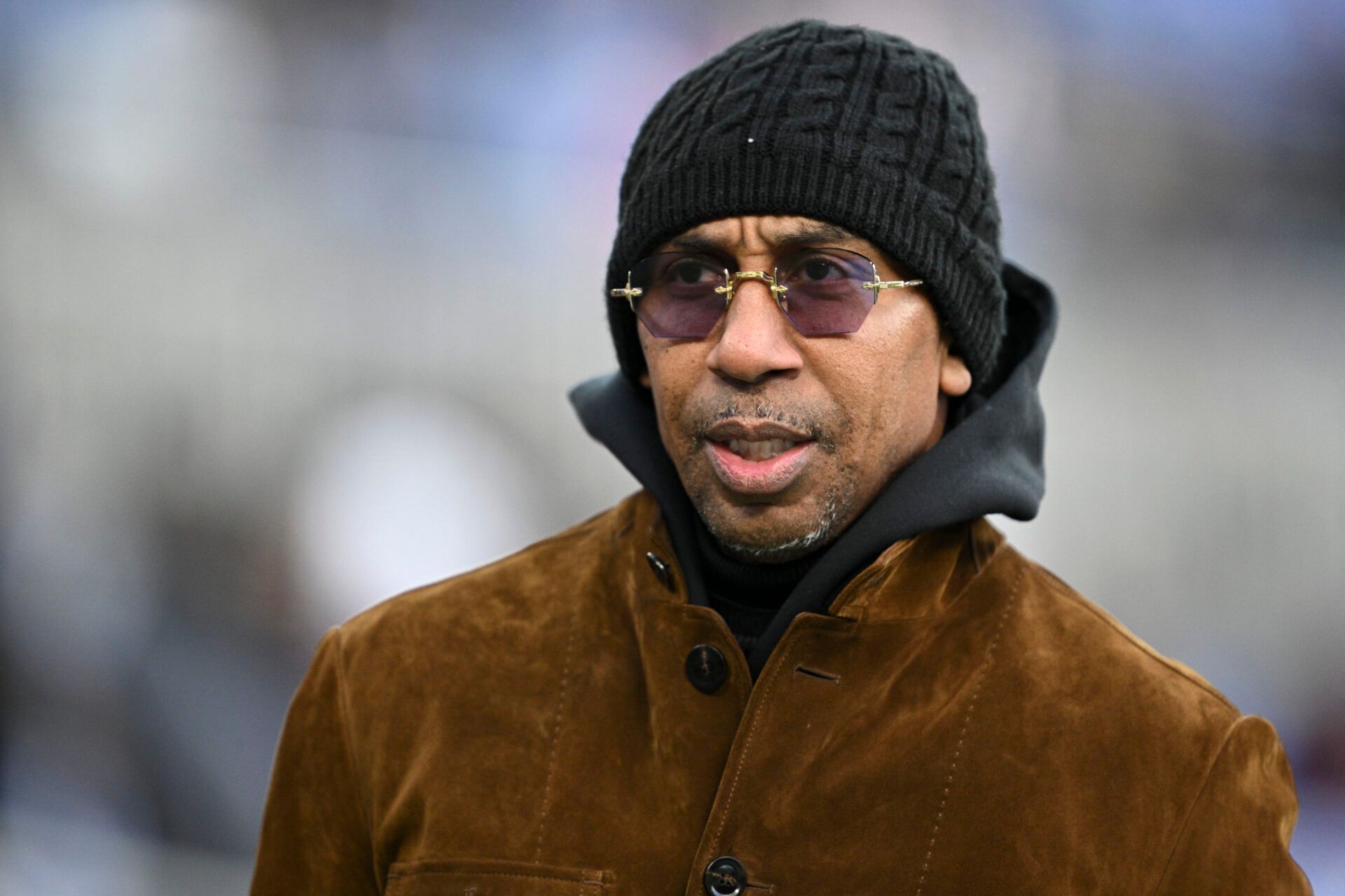 Stephen A. Smith , American sports television personality, walks on the field before the game between the Baltimore Ravens and the Pittsburgh Steelers at M&T Bank Stadium.