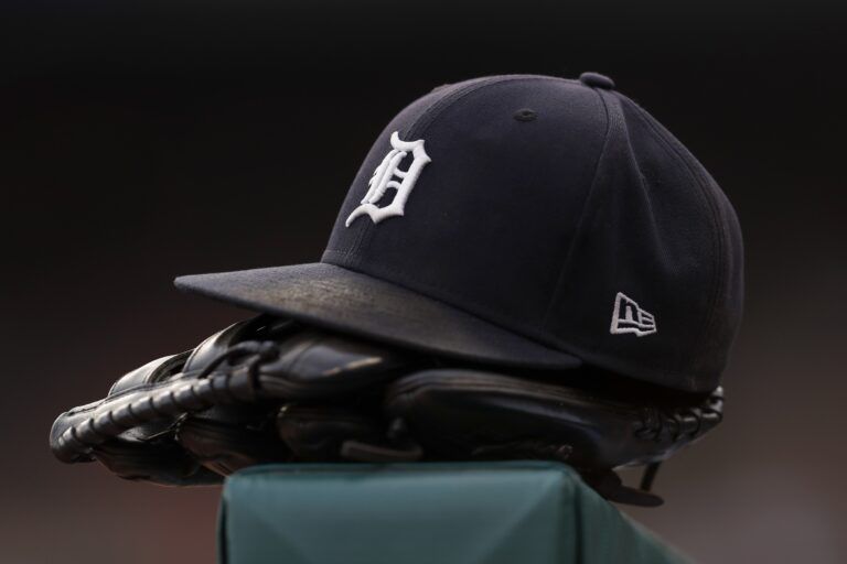 The hat and glove of Detroit Tigers right fielder Robbie Grossman (8) sits on the ledge of the dugout during the first inning against the Baltimore Orioles at Comerica Park.