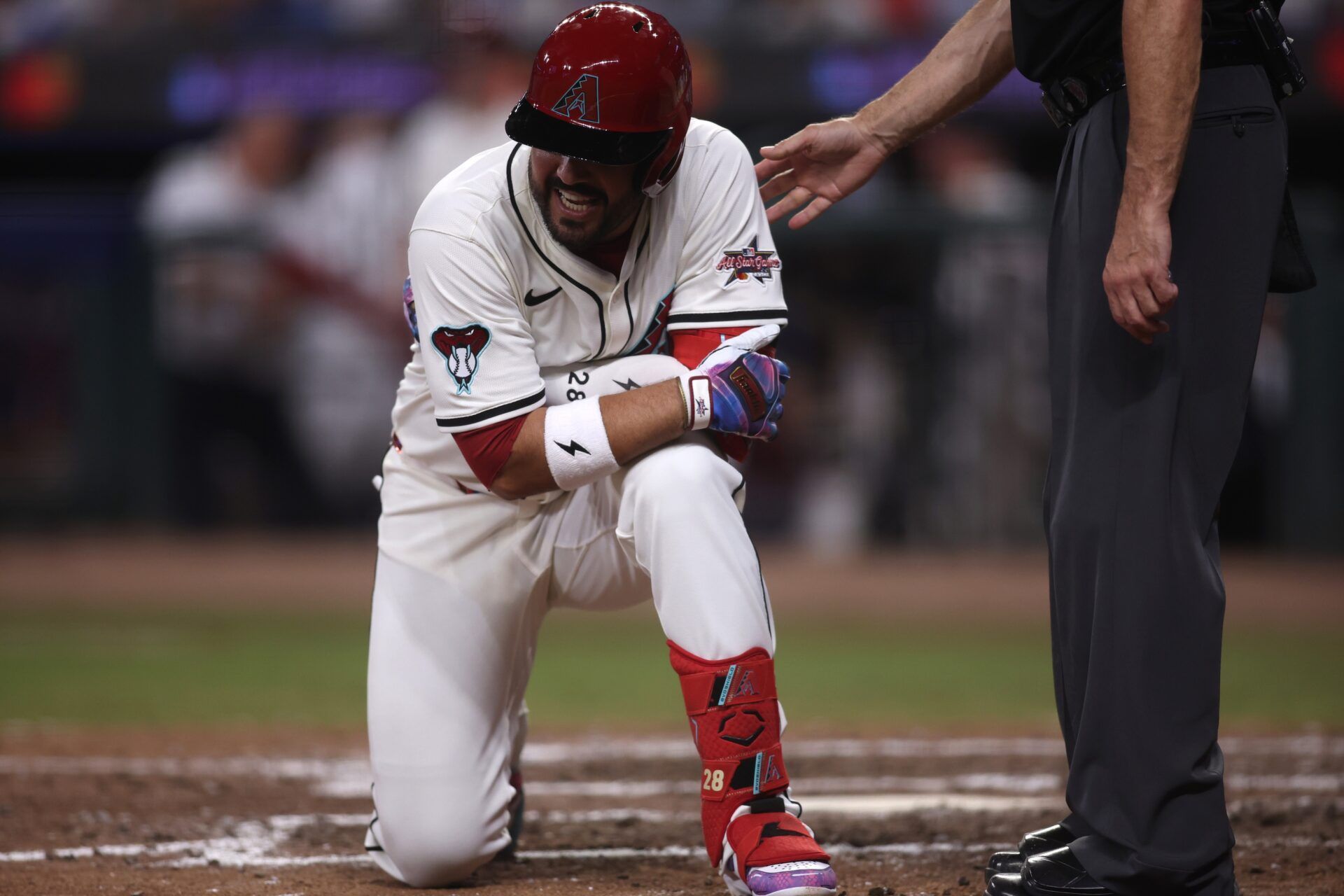 National League third baseman Eugenio Suarez (28) of the Arizona Diamondbacks reacts after getting hit by a pitch in the eighth inning during the 2025 MLB All Star Game at Truist Park.