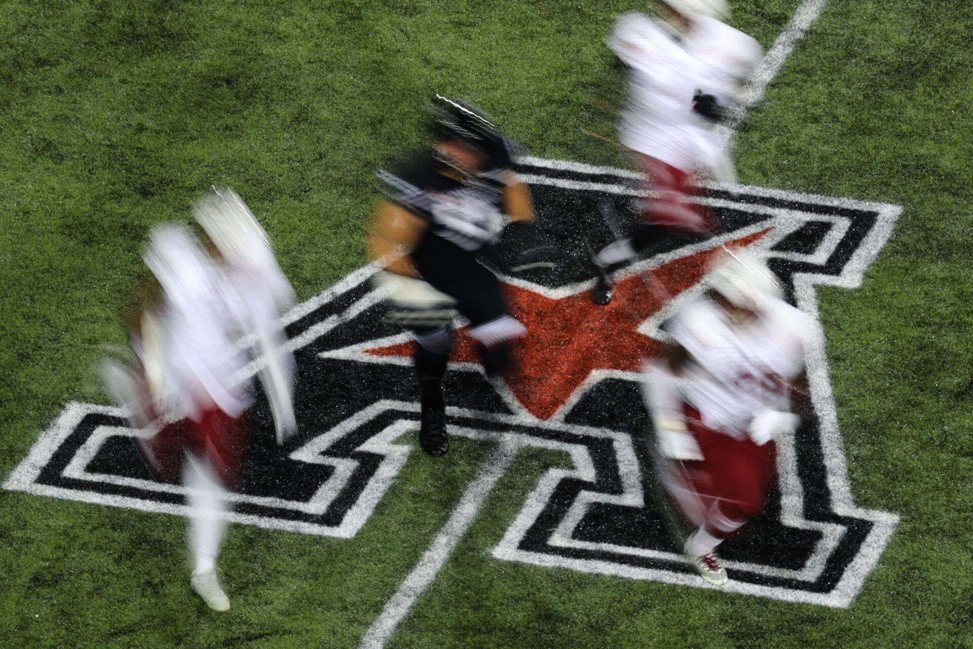 A view of the American Athletic Conference logo on the field during the game between the Temple Owls and the Cincinnati Bearcats at Nippert Stadium.