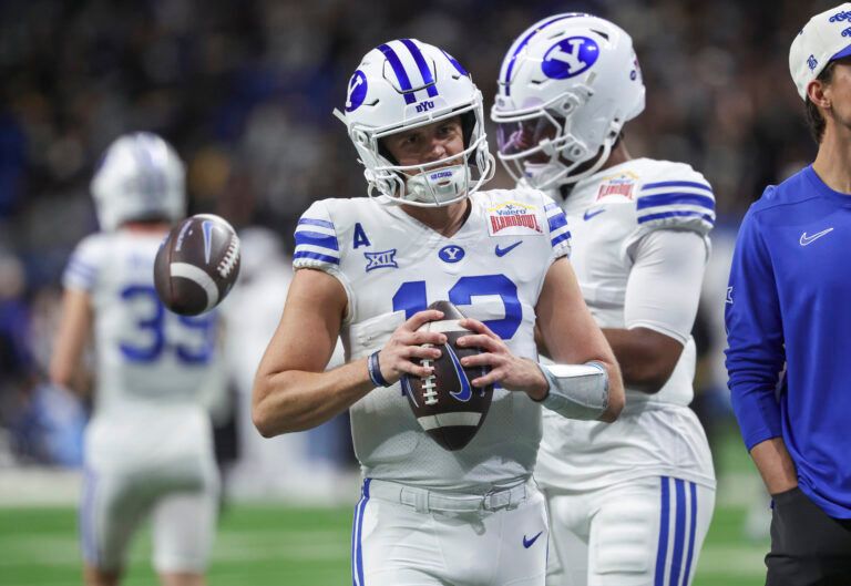 Brigham Young Cougars quarterback Jake Retzlaff (12) warms up before the game against the Colorado Buffaloes at Alamodome.