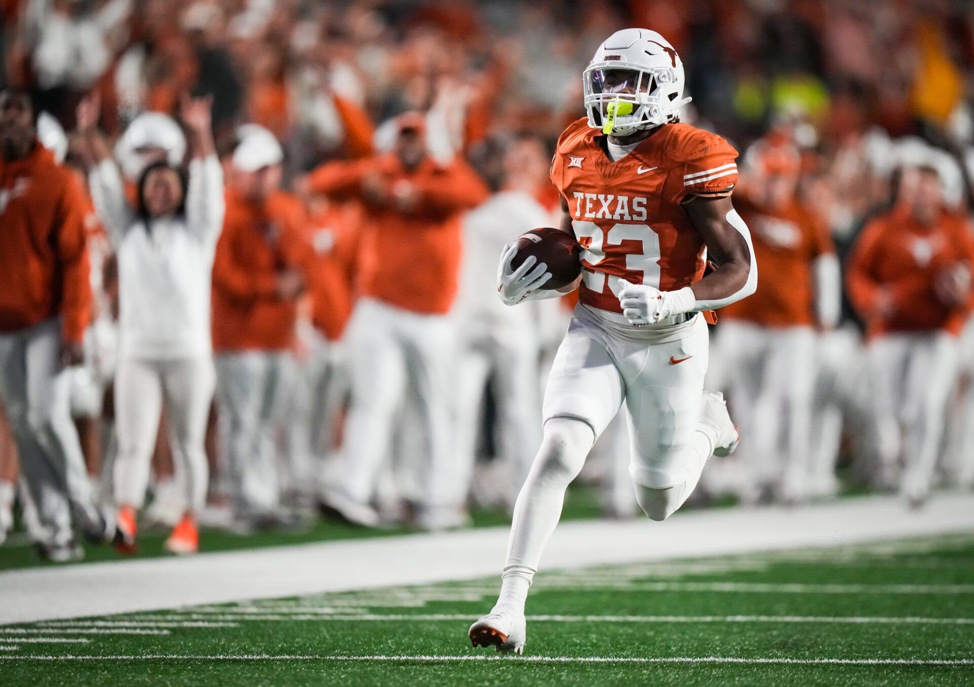 Texas running back Jaydon Blue runs the ball in to score a touchdown in the second quarter of the Longhorns' game against the Texas Tech Red Raiders, Friday, Nov. 24, 2023 at Darrell K Royal-Texas Memorial Stadium in Austin.