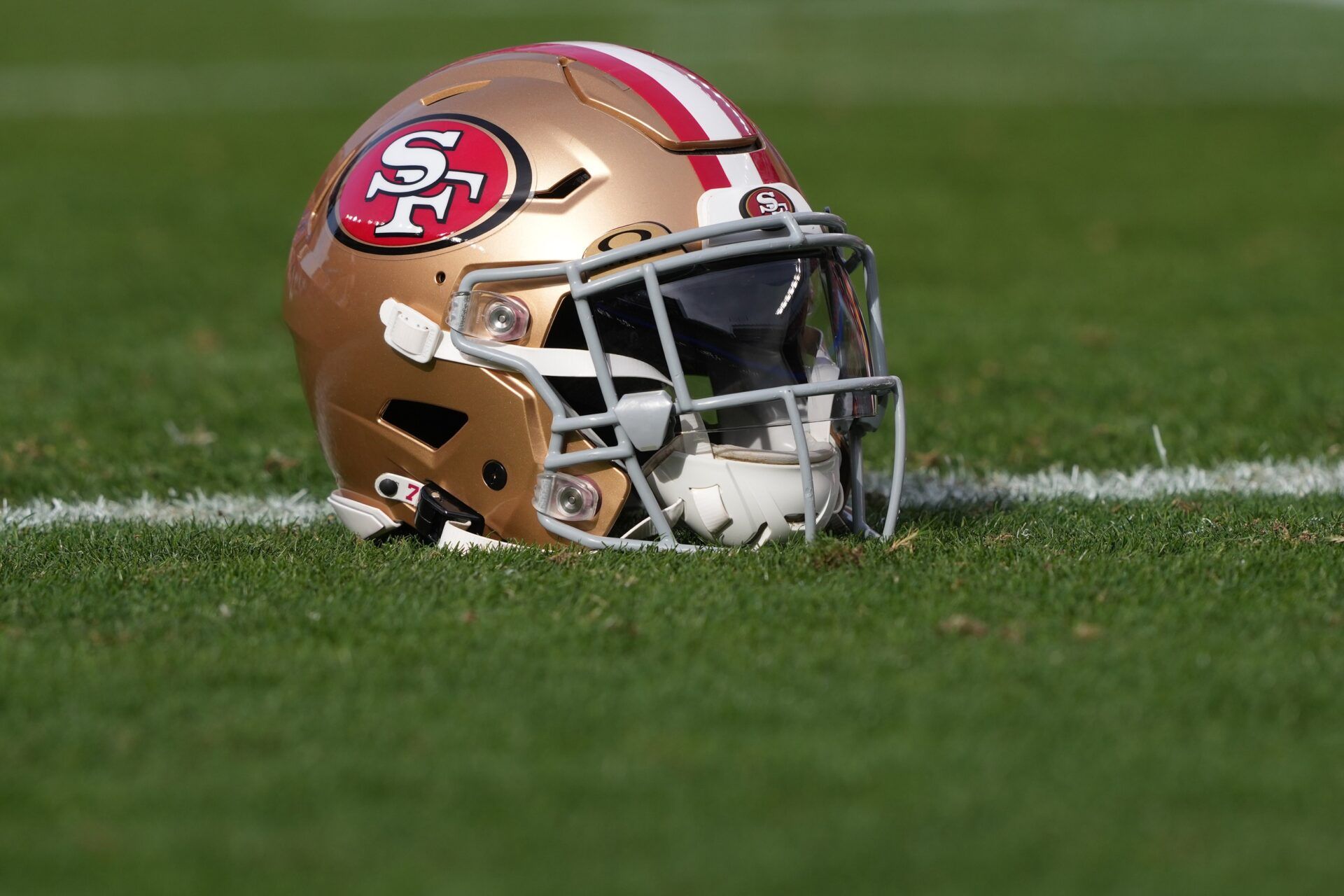 A San Francisco 49ers helmet sits on the field before the game against the Seattle Seahawks at Levi's Stadium.