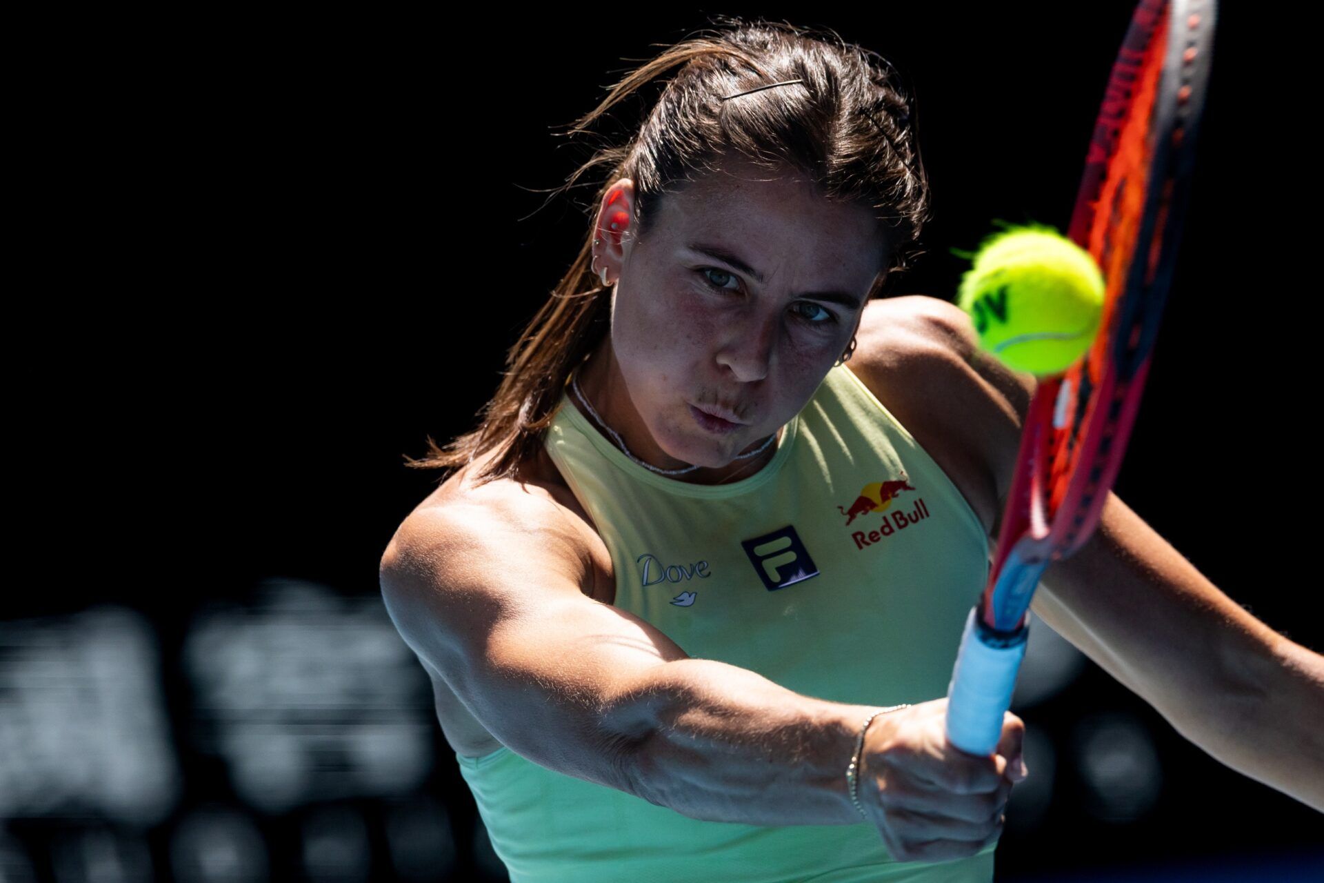 Emma Navarro of United States of America plays a backhand during her match against Iga Swiatek of Poland in the quarterfinals of the women's singles at the 2025 Australian Open at Melbourne Park.