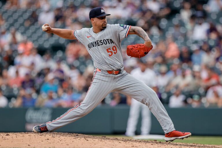 Minnesota Twins relief pitcher Jhoan Duran (59) pitches in the ninth inning against the Colorado Rockies at Coors Field.