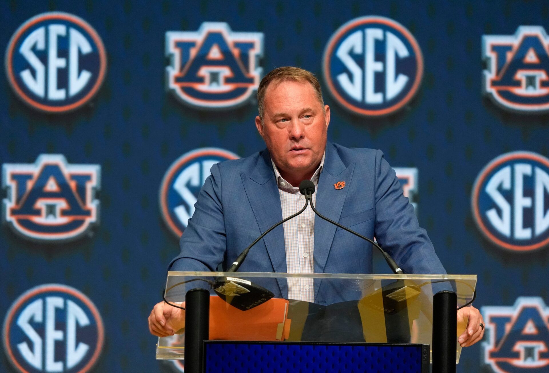 Auburn head coach Hugh Freeze speaks in the Main Media Room during SEC Media Days at the College Football Hall of Fame in Atlanta.