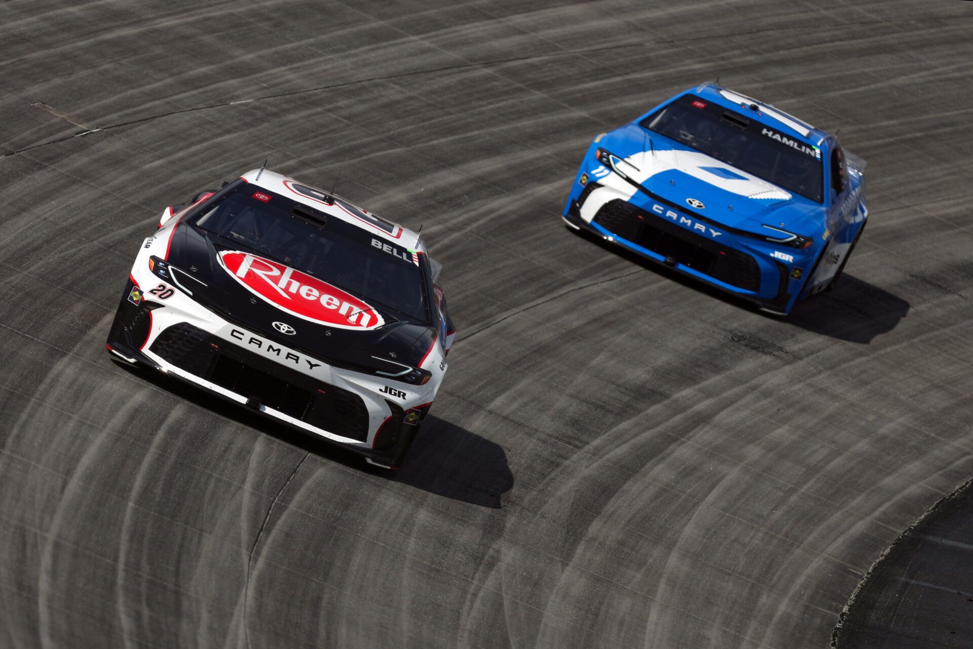NASCAR Cup Series driver Christopher Bell (20) races driver Denny Hamlin (11) during the Autotrader EchoPark Automotive 400 at Dover Motor Speedway.