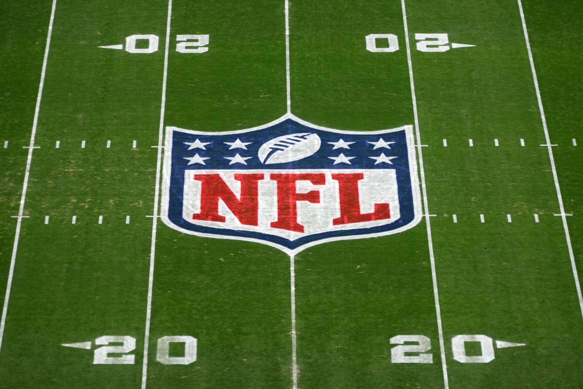 The NFL shield logo at midfield of the Pro Bowl Games flag football field at Allegiant Stadium.