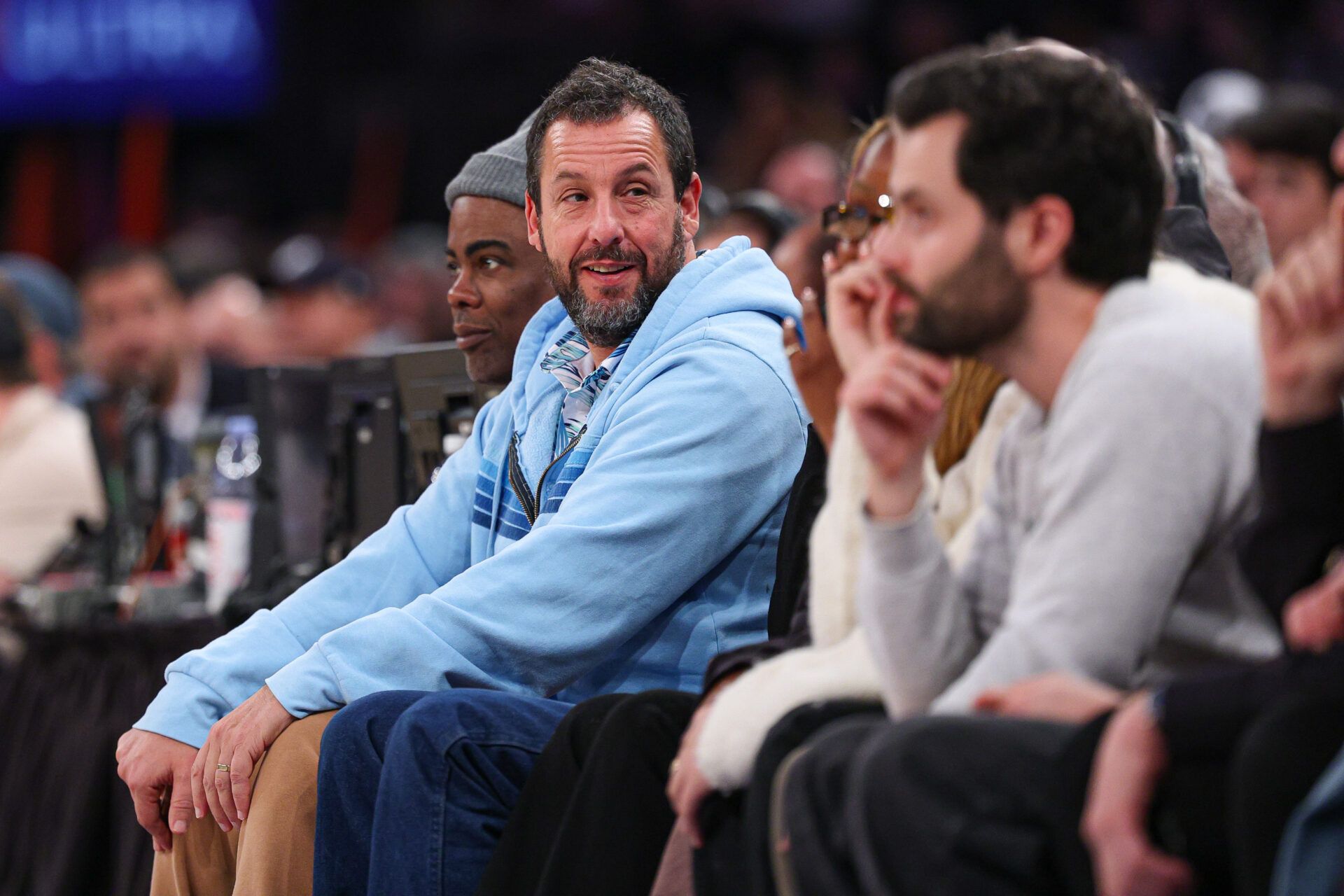 Actor and comedian Adam Sandler looks on during the first half of the  NBA game between the New York Knicks and the Atlanta Hawks at Madison Square Garden.