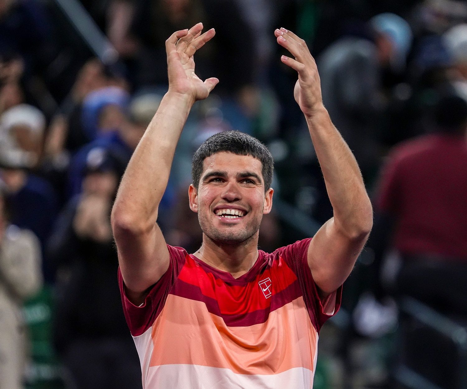 Carlos Alcaraz celebrates with the crowd after winning his quarterfinal match against Francisco Cerundolo at the BNP Paribas Open in Indian Wells, Calif., Thursday, March 13, 2025.