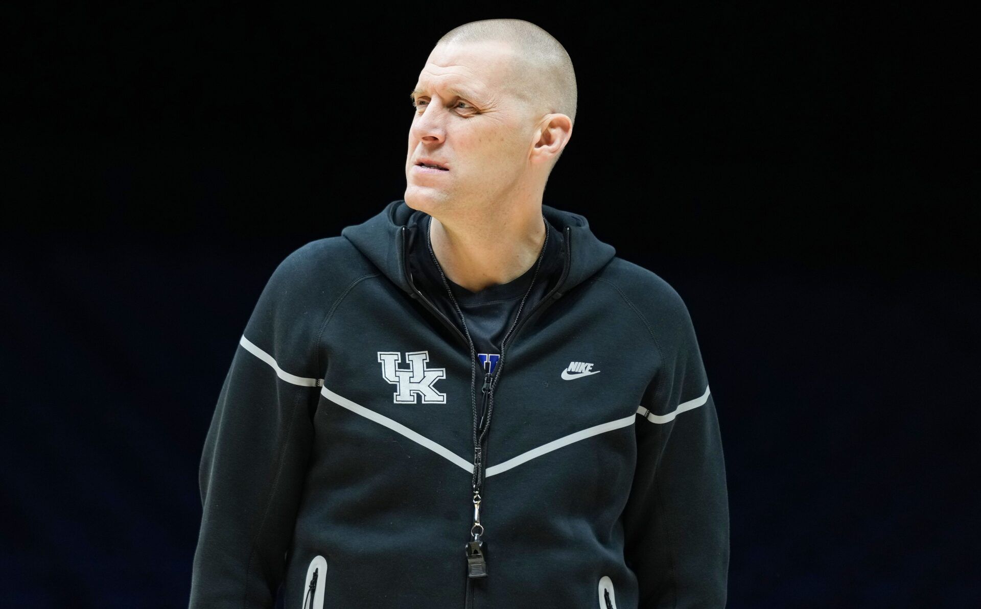 Kentucky Wildcats head coach Mark Pope walks onto the court Thursday, March 27, 2025, during practice ahead of the Sweet 16 March Madness tournament game against the Tennessee Volunteers at Lucas Oil Stadium in Indianapolis.