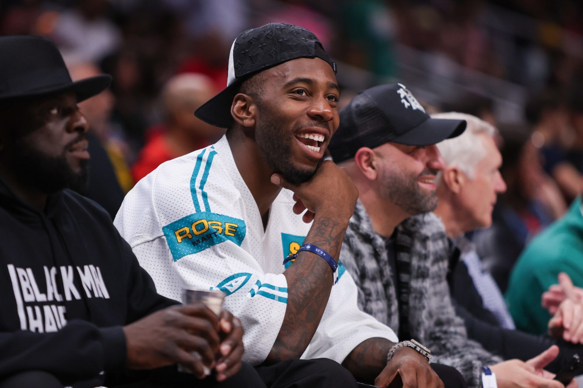 Atlanta Falcons tight end Kyle Pitts (8) watch a game between the Atlanta Hawks and Utah Jazz in the third quarter at State Farm Arena.