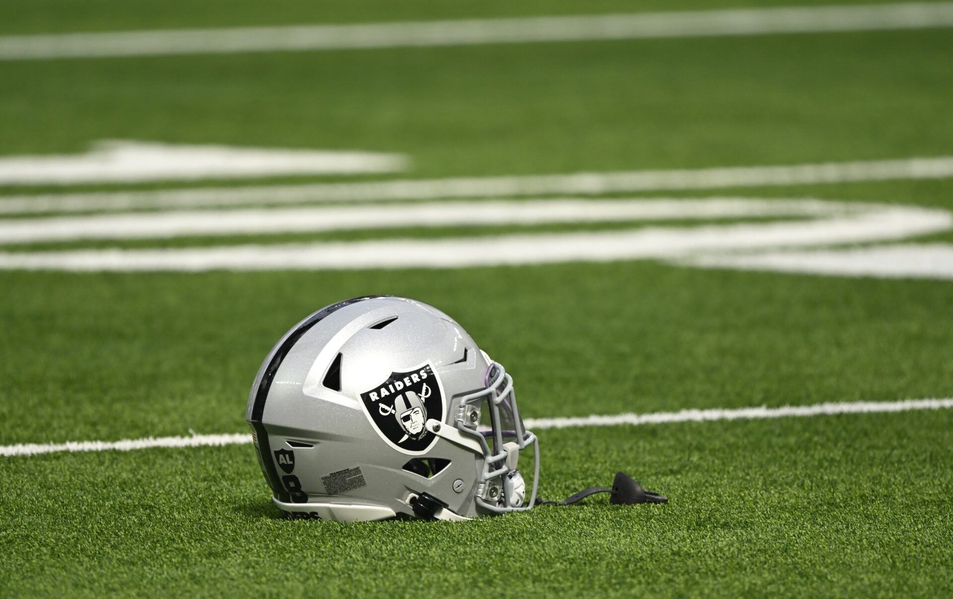 Las Vegas Raiders helmet on the turn at SoFi Stadium during pregame warmups before an NFL game against the Los Angeles Rams.