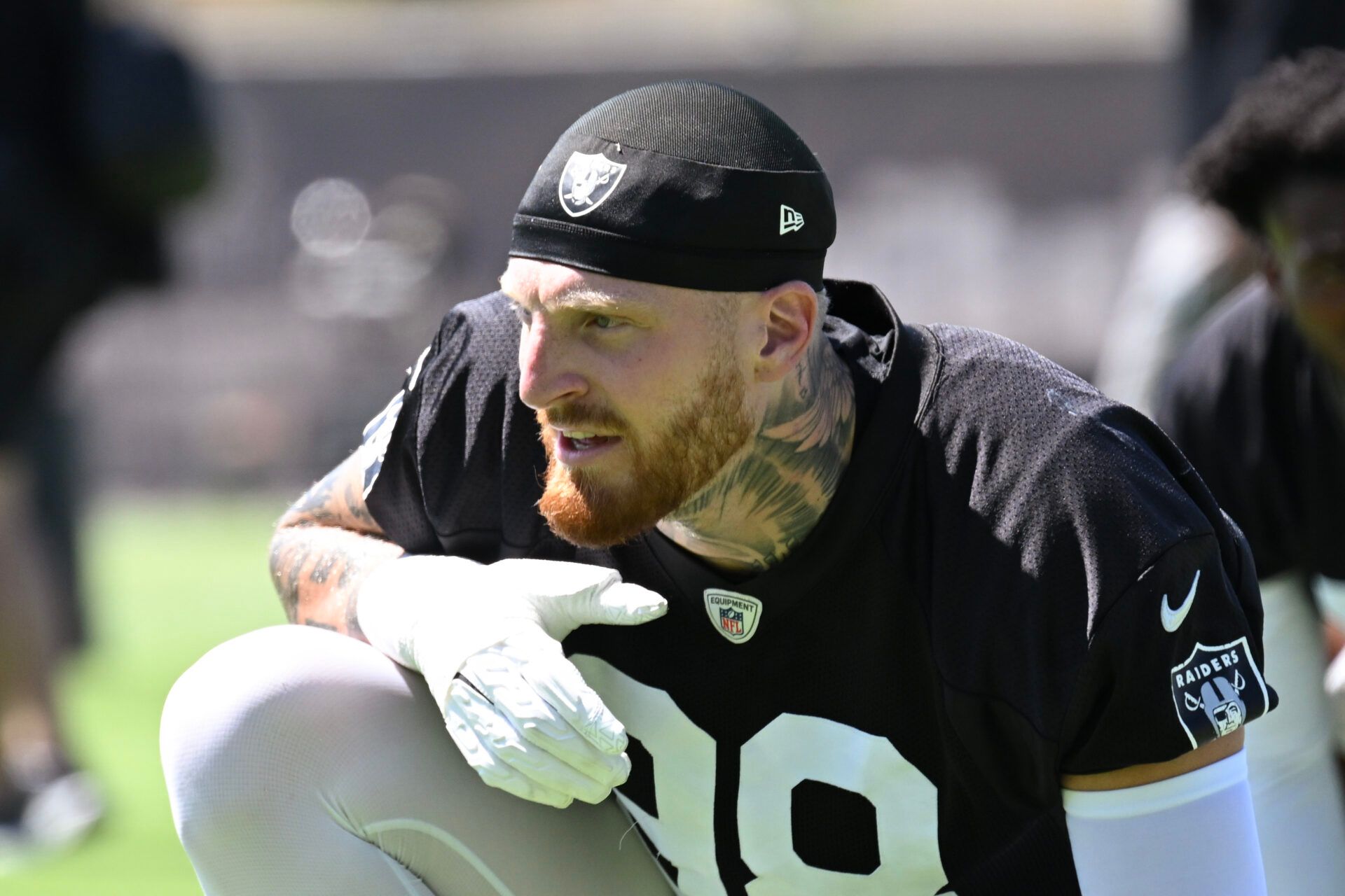 Las Vegas Raiders defensive end Maxx Crosby (98) looks on during the team stretch during Las Vegas Raiders Minicamp at Intermountain Health Performance Center.