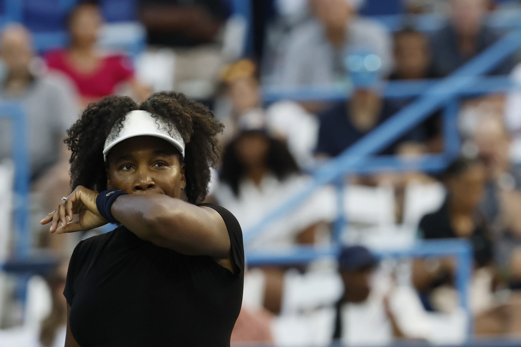 Venus Williams (USA) wipes her face between points against Peyton Stearns (USA)(not pictured) in a women's singles match on day two of the Mubadala Citi DC Open at Rock Creek Park Tennis Center.