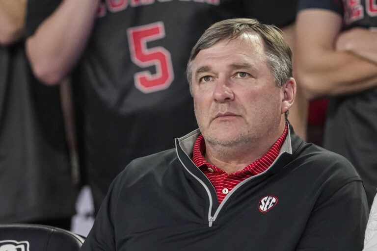 Georgia Bulldogs head football coach Kirby Smart watches the basketball game between Georgia and the Florida Gators during the second half at Stegeman Coliseum.