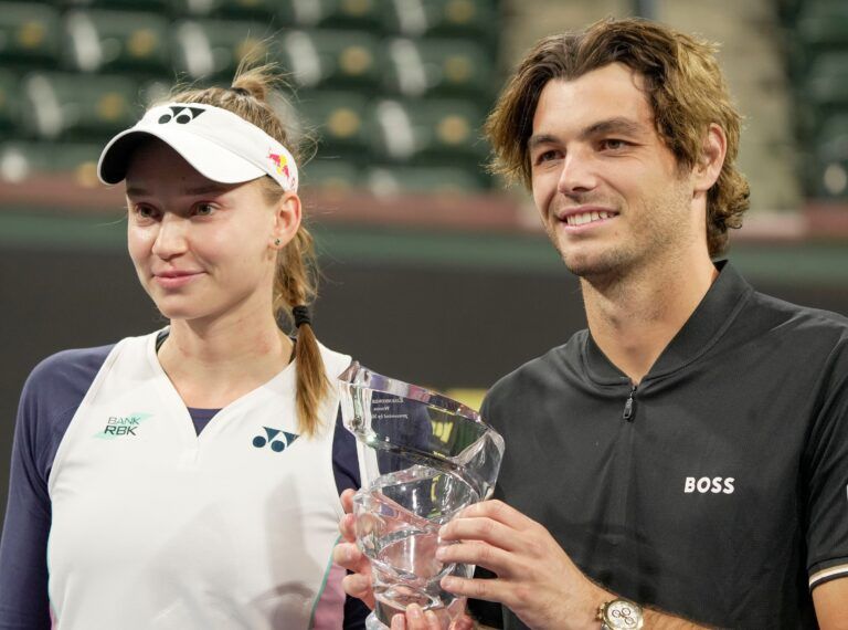 Elena Rybakina, left, and Taylor Fritz hold the trophy after winning the Eisenhower Cup Tie Break Tens during the BNP Paribas Open in Indian Wells, Calif., March 4, 2025.