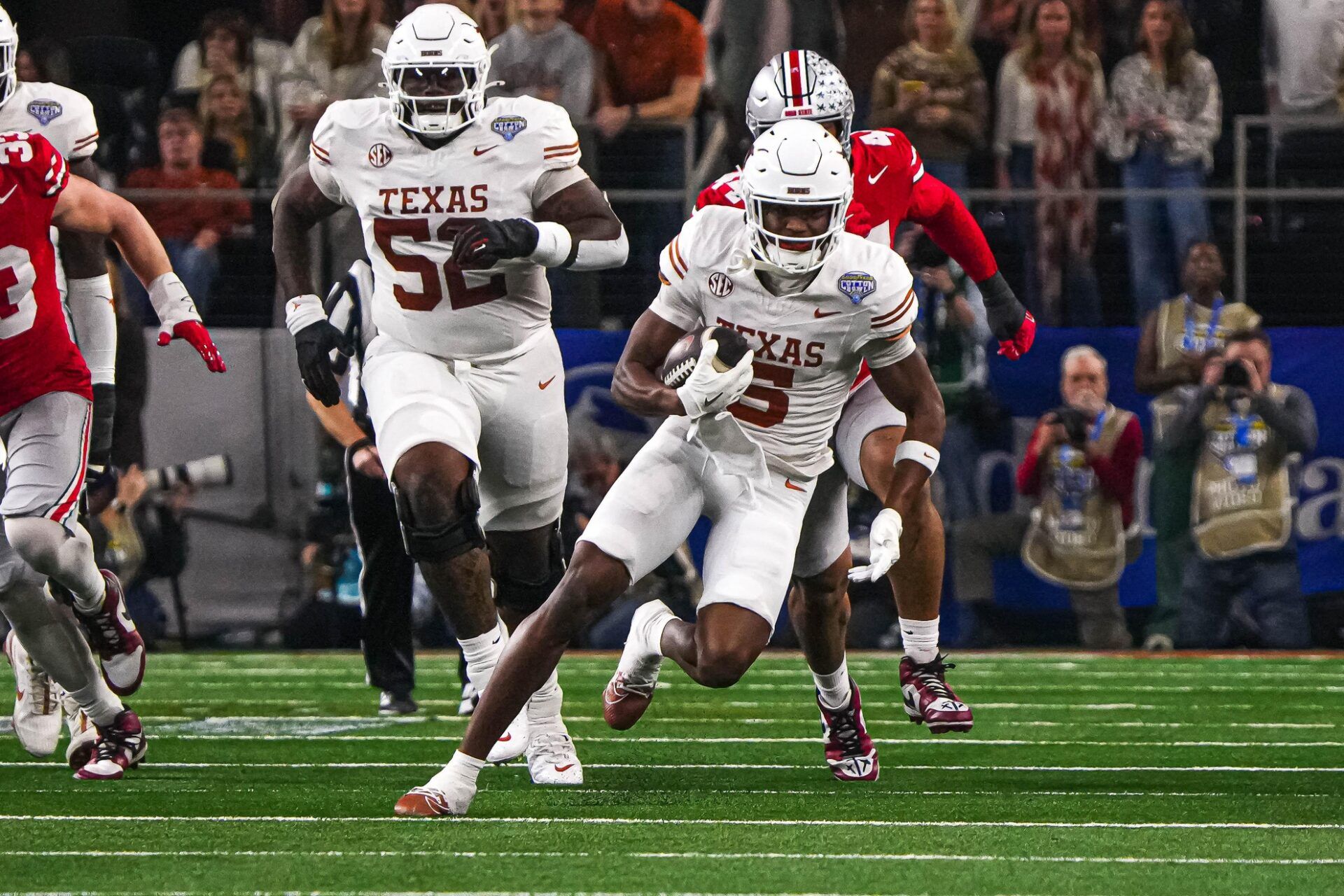 Texas Longhorns receiver Ryan Wingo (5) runs the ball during the College Football Playoff semifinal game against Ohio State in the Cotton Bowl at AT&T Stadium on Friday, Jan. 10, 2024 in Arlington, Texas.