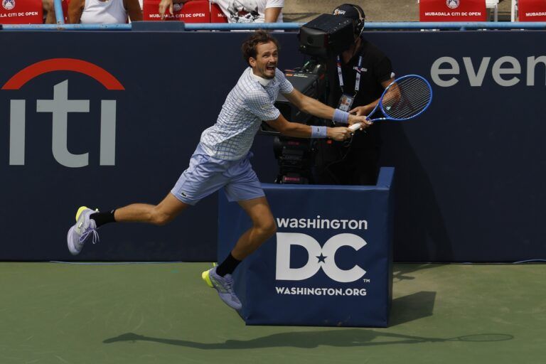 Daniil Medvedev reaches for a backhand in front of an on-court tv camera against Reilly Opelka (USA)(not pictured) in a men's singles match on day three of the Mubadala Citi DC Open at Rock Creek Park Tennis Center.