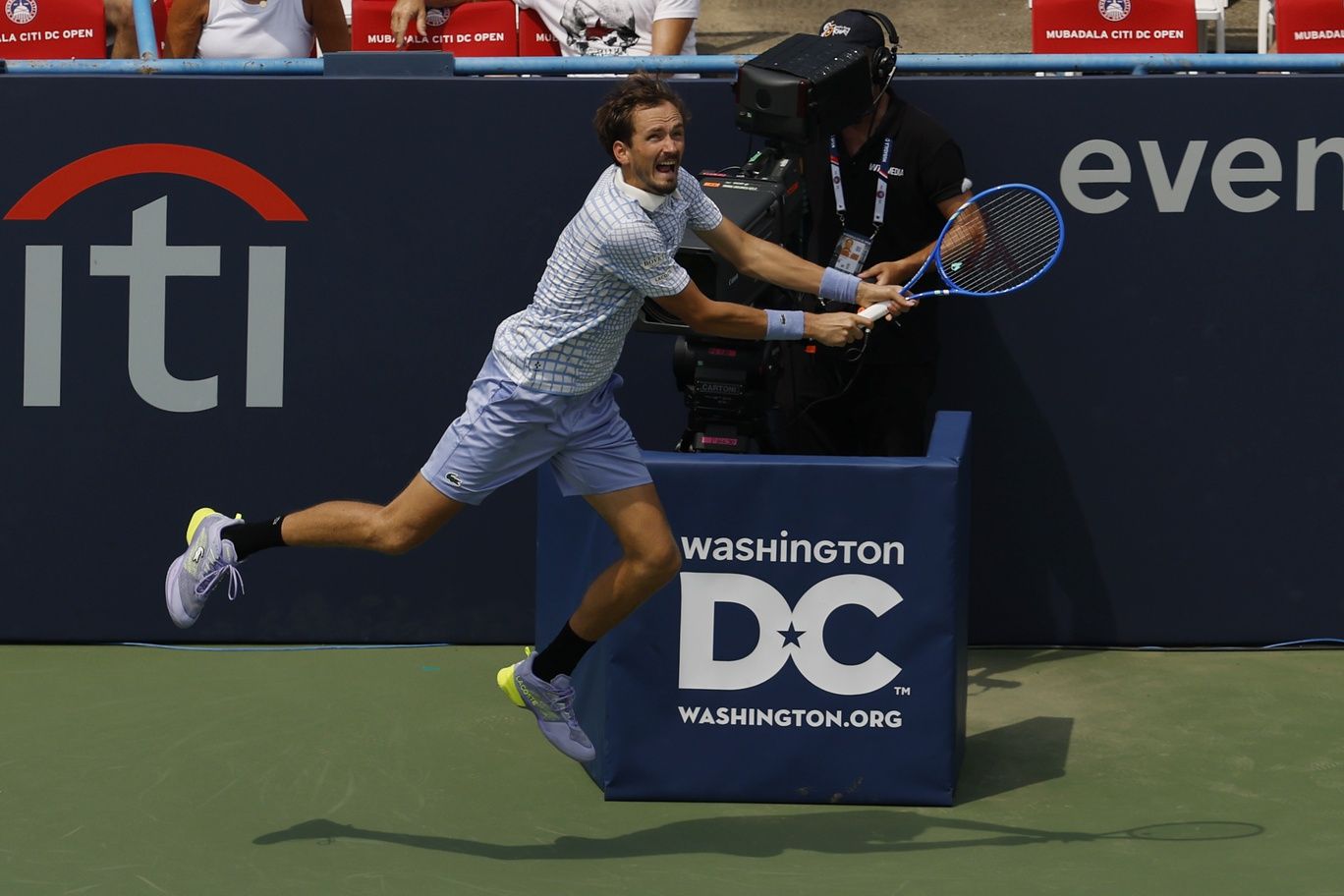 Daniil Medvedev reaches for a backhand in front of an on-court tv camera against Reilly Opelka (USA)(not pictured) in a men's singles match on day three of the Mubadala Citi DC Open at Rock Creek Park Tennis Center.