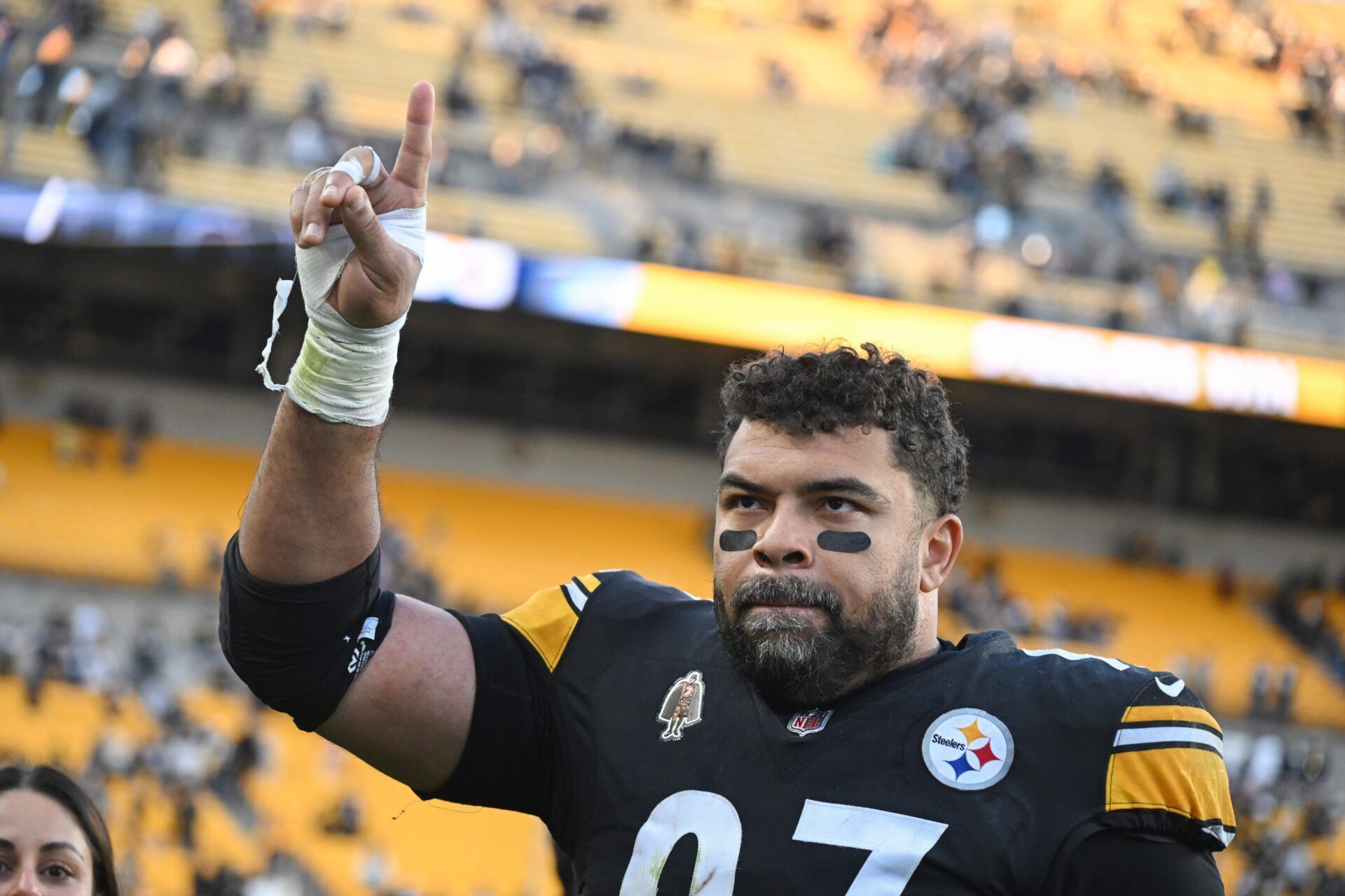 Pittsburgh Steelers defensive tackle Cameron Heyward (97) celebrates with fans following a game against the Cleveland Browns at Acrisure Stadium.