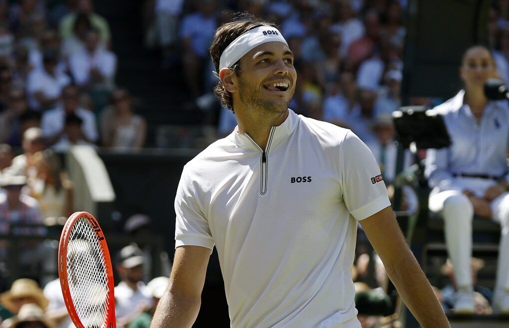 Taylor Fritz (USA) smiles after attempting a diving volley against Carlos Alcaraz (ESP)(not pictured) in a gentlemen's singles semi-final on day 11 of The Championships Wimbledon 2025 at All England Lawn Tennis and Croquet Club.