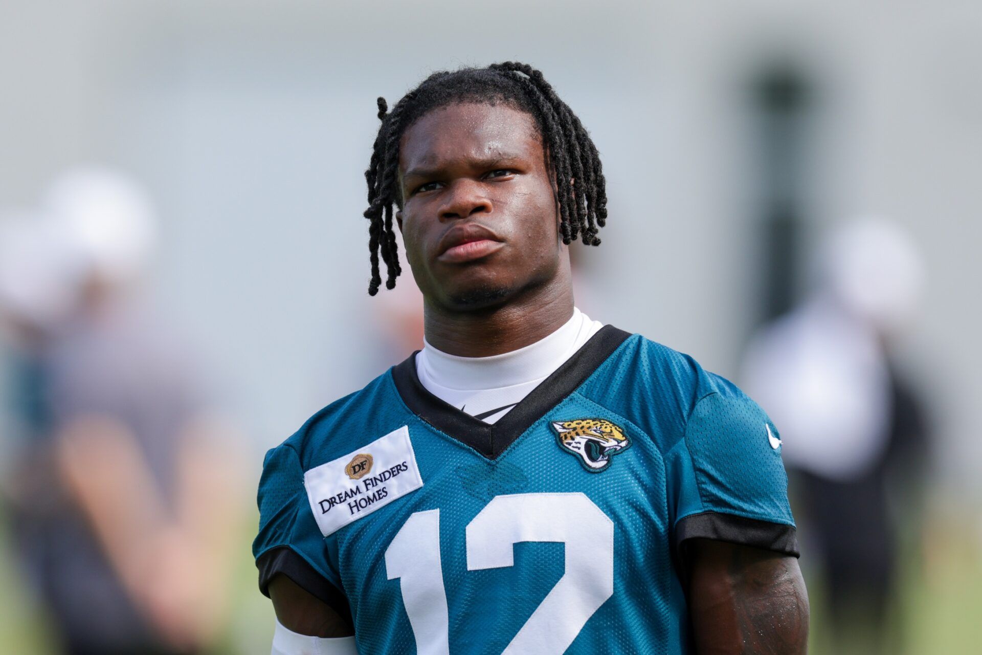 Jacksonville Jaguars wide receiver Travis Hunter (12) looks on after training camp at Miller Electric Center.