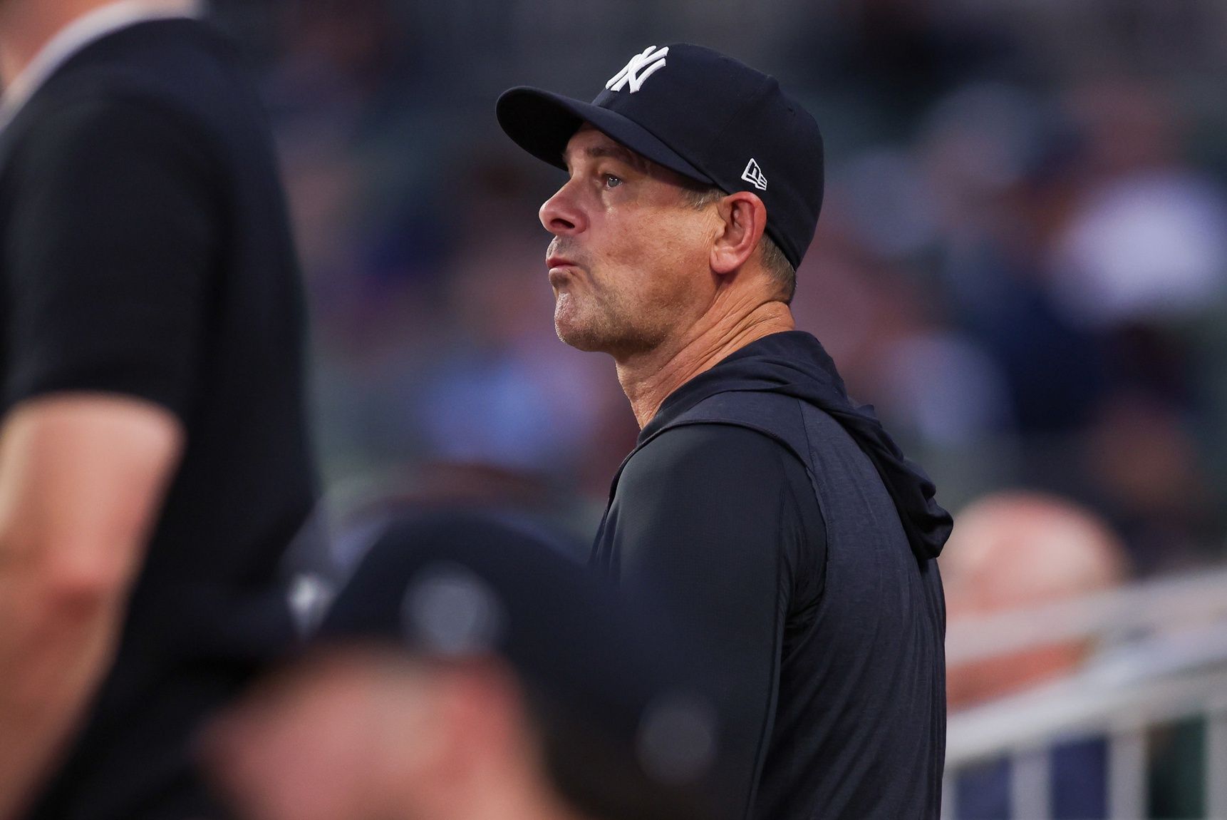 New York Yankees manager Aaron Boone (17) in the dugout against the Atlanta Braves in the fifth inning at Truist Park.