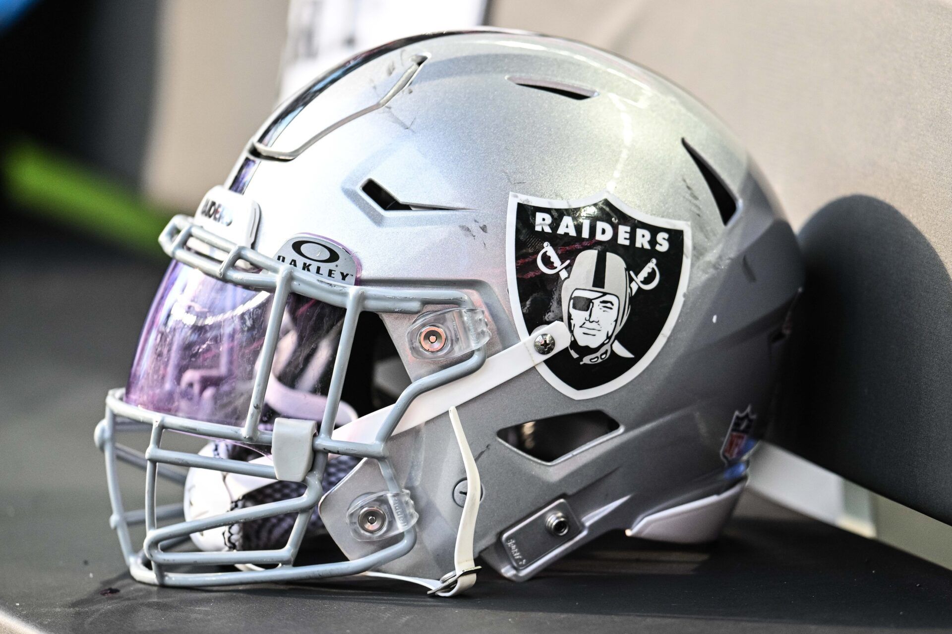 A Las Vegas Raiders helmet sits on the team bench before the game against the Minnesota Vikings at U.S. Bank Stadium.
