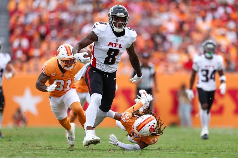Atlanta Falcons tight end Kyle Pitts (8) holds off Tampa Bay Buccaneers cornerback Tyrek Funderburk (24) in the second quarter  at Raymond James Stadium.
