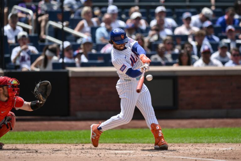 New York Mets shortstop Francisco Lindor (12) hits a RBI single against the Los Angeles Angels during the third inning at Citi Field.