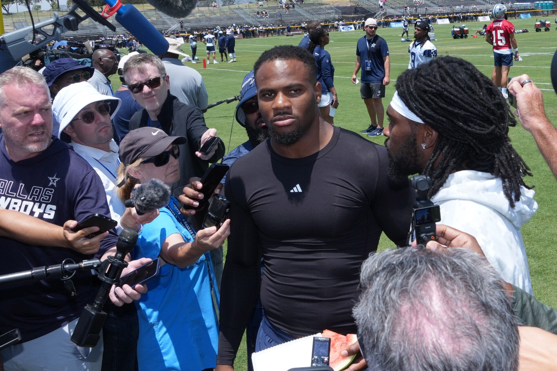 Dallas Cowboys defensive end Micah Parsons (left) and cornerback Trevon Diggs talks to media during training camp at the River Ridge Fields.
