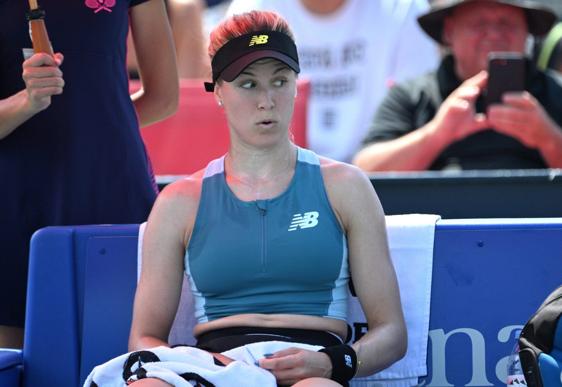 Eugenie Bouchard (CAN) reacts during a time out against Moyuka Uchijima (JPN) (not shown) during first round qualifying play at Sobeys Stadium.