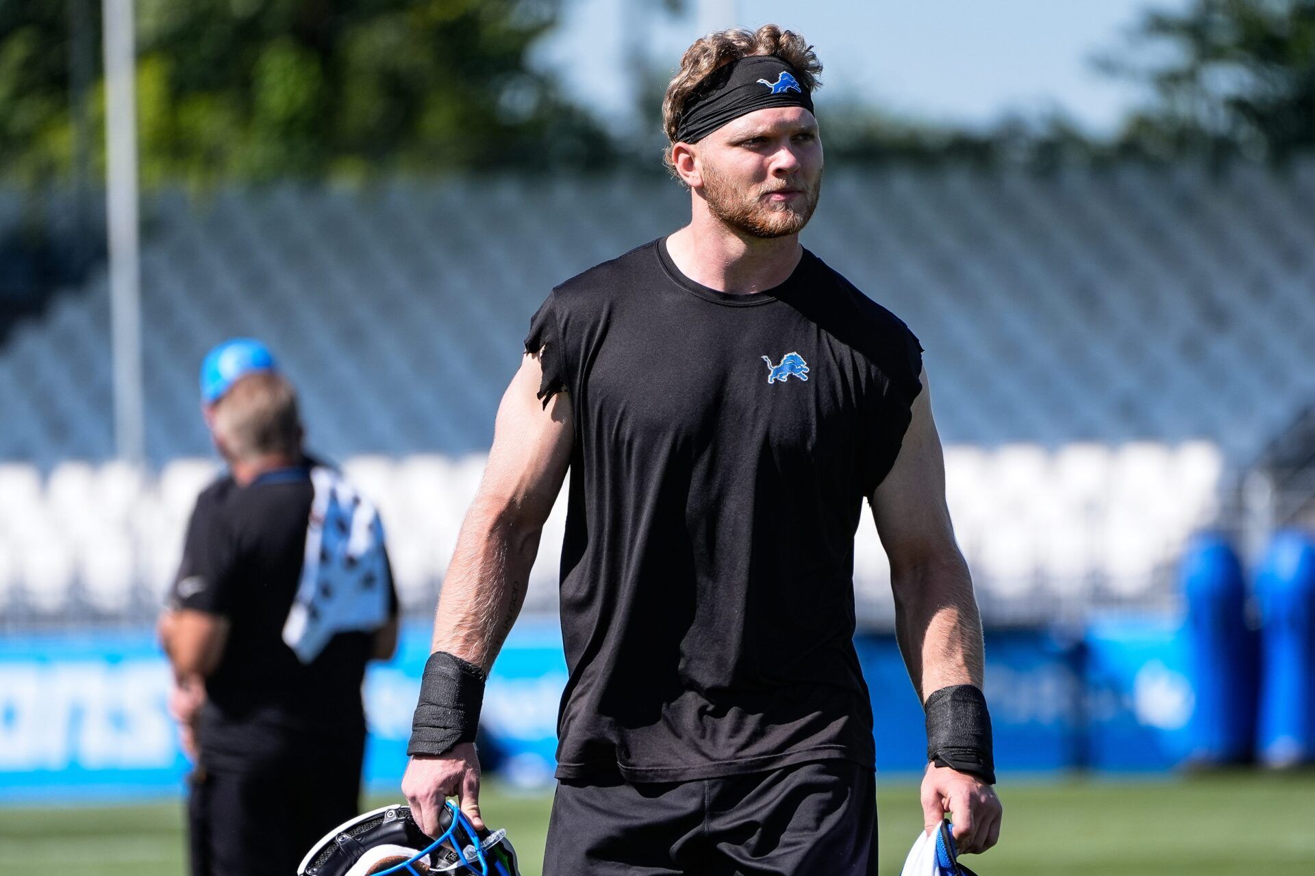 Detroit Lions defensive end Aidan Hutchinson (97) walk of the field after practice during training camp at Meijer Performance Center in Allen Park on Tuesday, July 22, 2025.