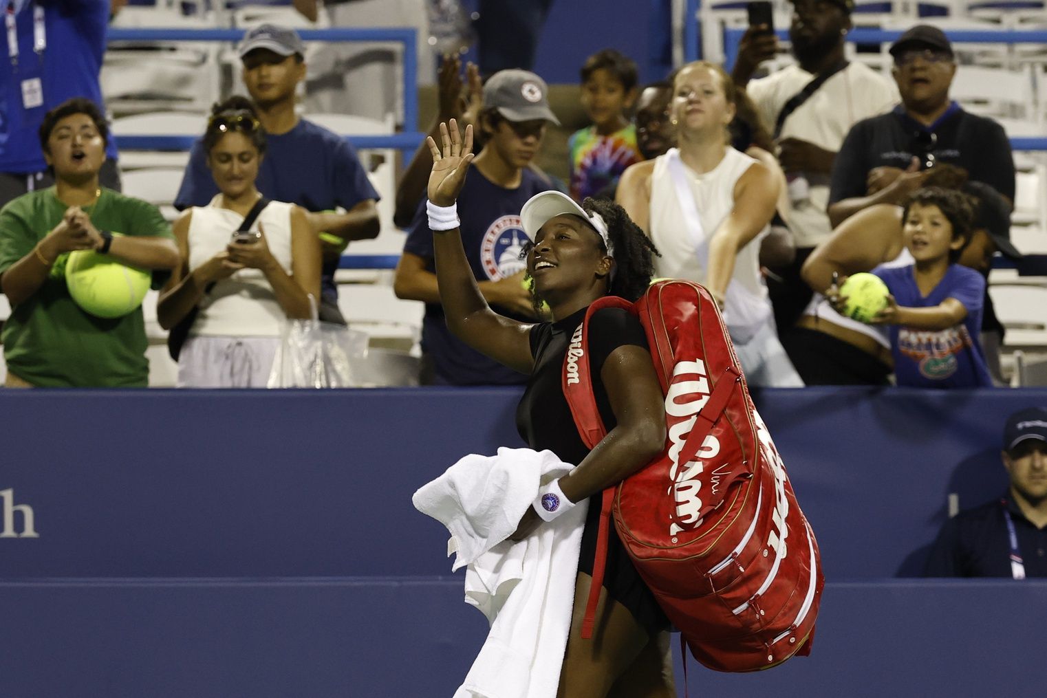 Venus Williams (USA) waves to the crowd while leaving the court after her match against Magdalena Frech (POL)(not pictured) in a women's singles match on day four of the Mubadala Citi DC Open at Rock Creek Park Tennis Center.