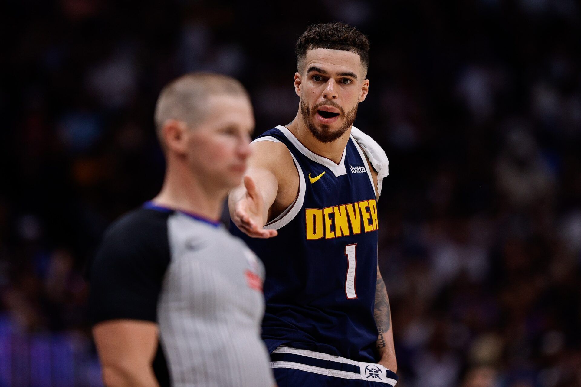 Denver Nuggets forward Michael Porter Jr. (1) gestures to referee Tyler Ford in the second quarter against the Oklahoma City Thunder during game four of the second round of the 2025 NBA Playoffs at Ball Arena.