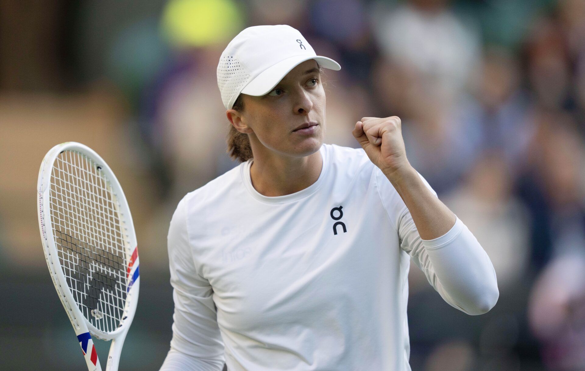 Iga Swiatek of Poland reacts to a point during her match against Clara Tauson of Denmark on day eight at All England Lawn Tennis and Croquet Club.
